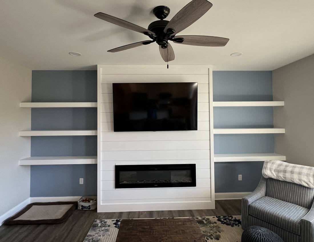 Custom fireplace feature wall with built-in floating shelves