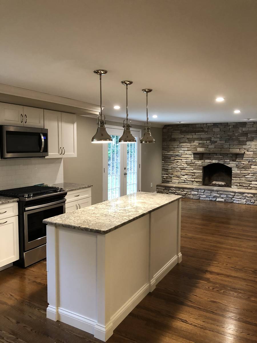 Bright renovated kitchen with cathedral ceiling and pass-through