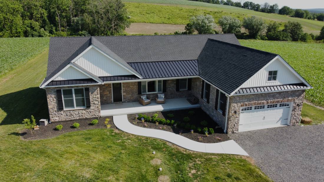 Aerial view of a newly built single-family home on an open lot